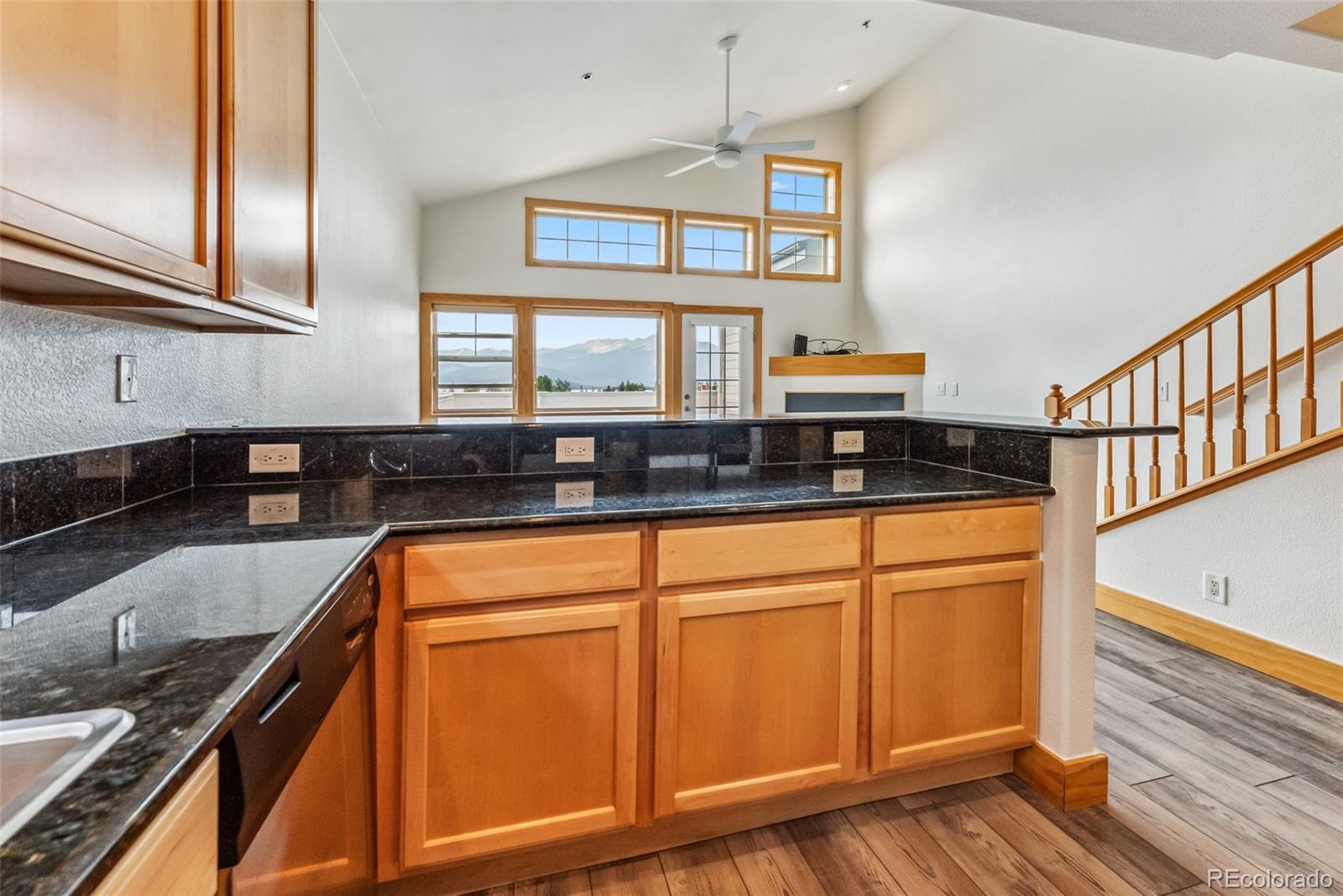 135 Main Street, Unit 214 Dillon, CO 80435 - Photo 11 of 42 a kitchen with stainless steel appliances granite countertop a sink and a stove