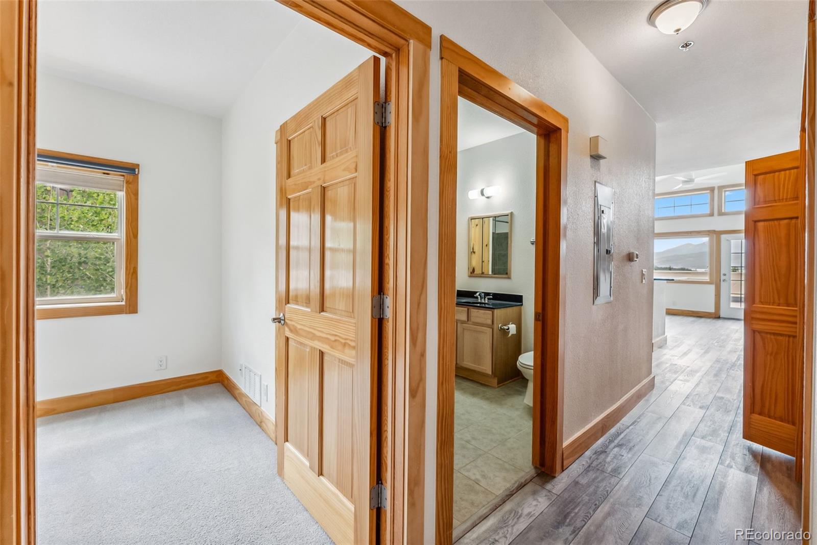 135 Main Street, Unit 214 Dillon, CO 80435 - Photo 15 of 42 a view of hallway with livingroom and wooden floor