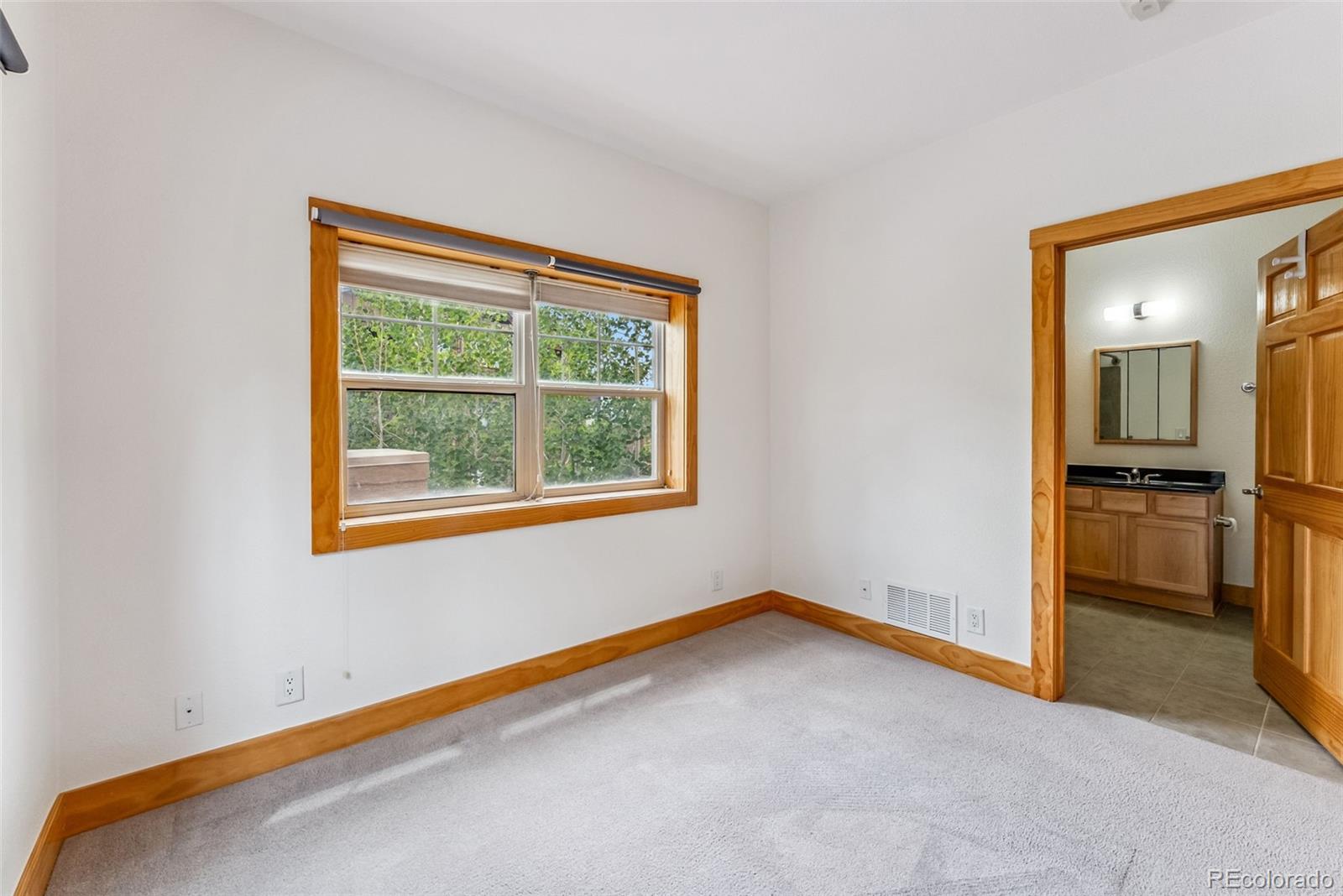 135 Main Street, Unit 214 Dillon, CO 80435 - Photo 18 of 42 a view of a room with a empty space and a window