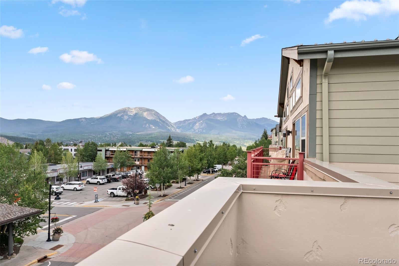 135 Main Street, Unit 214 Dillon, CO 80435 - Photo 34 of 42 a view of a terrace with a garden and bench