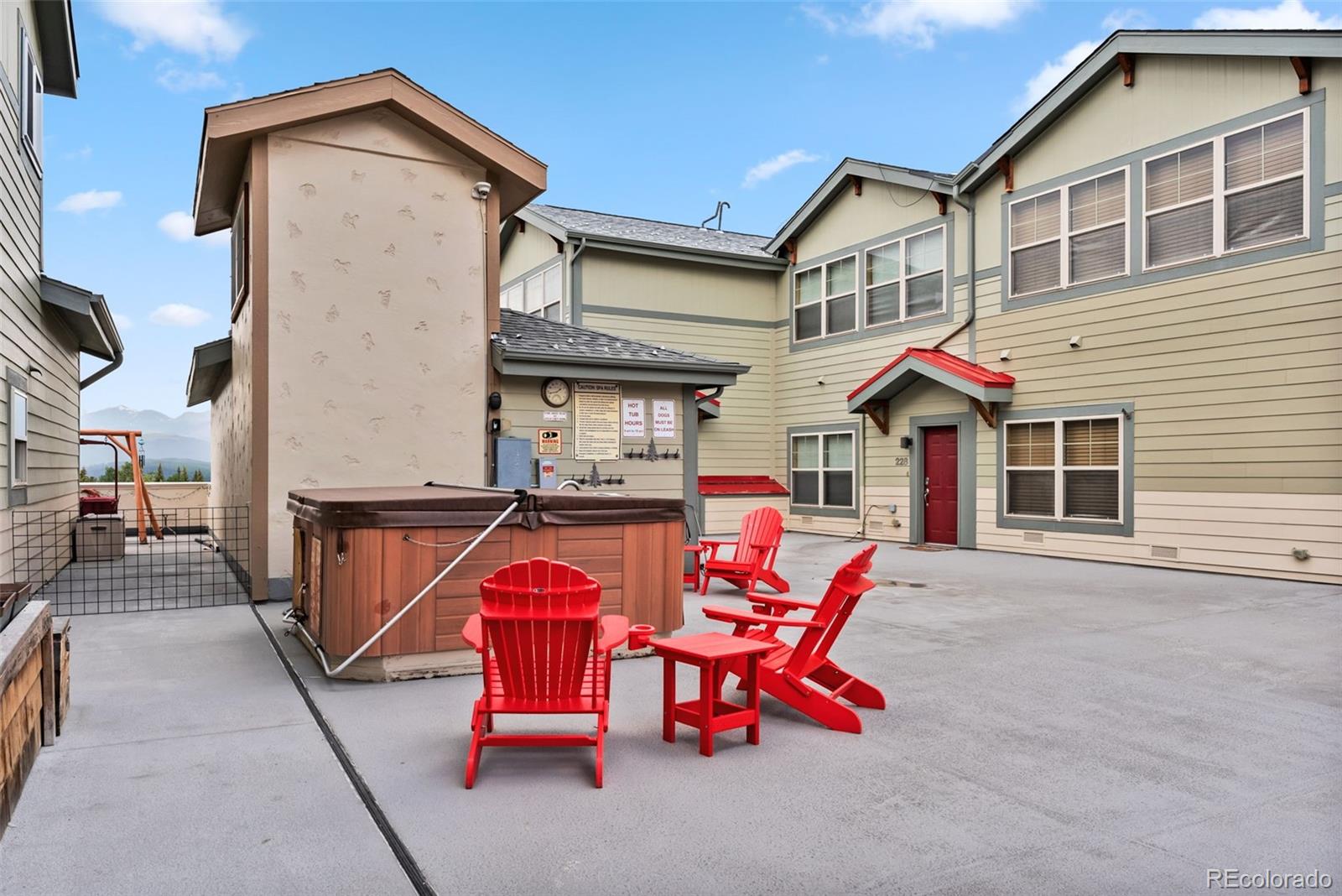 135 Main Street, Unit 214 Dillon, CO 80435 - Photo 39 of 42 a view of a house with a chairs and table in a patio