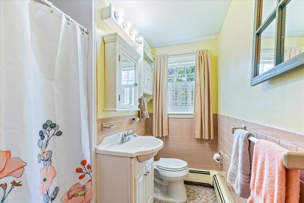 8 Stonewood Drive Canton, MA 02021 - Photo 12 of 29 a bathroom with a sink toilet and shower