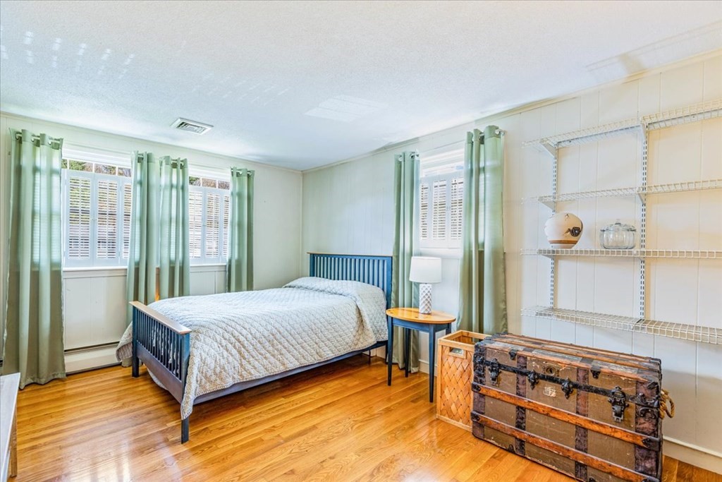 8 Stonewood Drive Canton, MA 02021 - Photo 17 of 29 a bedroom with a bed and wooden floor
