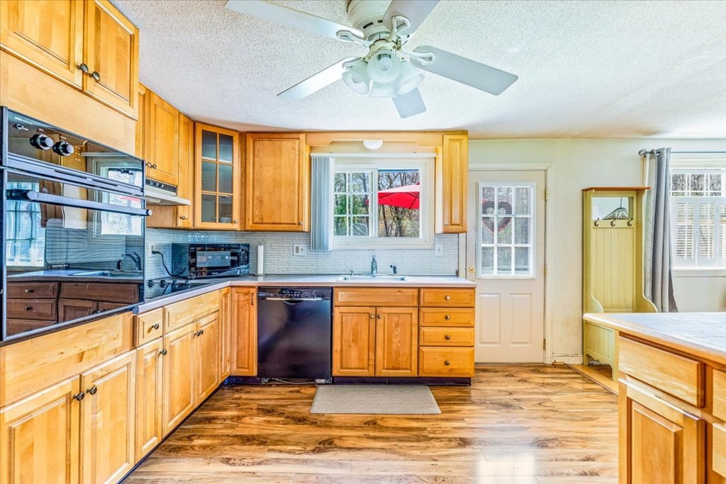 8 Stonewood Drive Canton, MA 02021 - Photo 7 of 29 a kitchen with stainless steel appliances granite countertop a stove and a sink