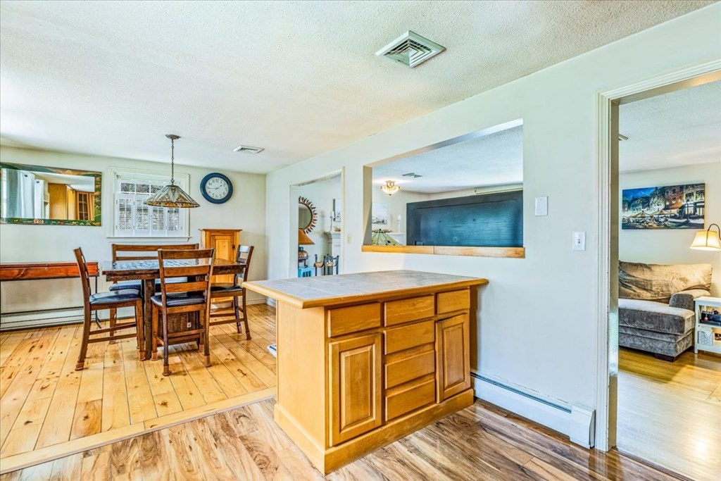 8 Stonewood Drive Canton, MA 02021 - Photo 8 of 29 a view of a dining room with furniture and a mirror