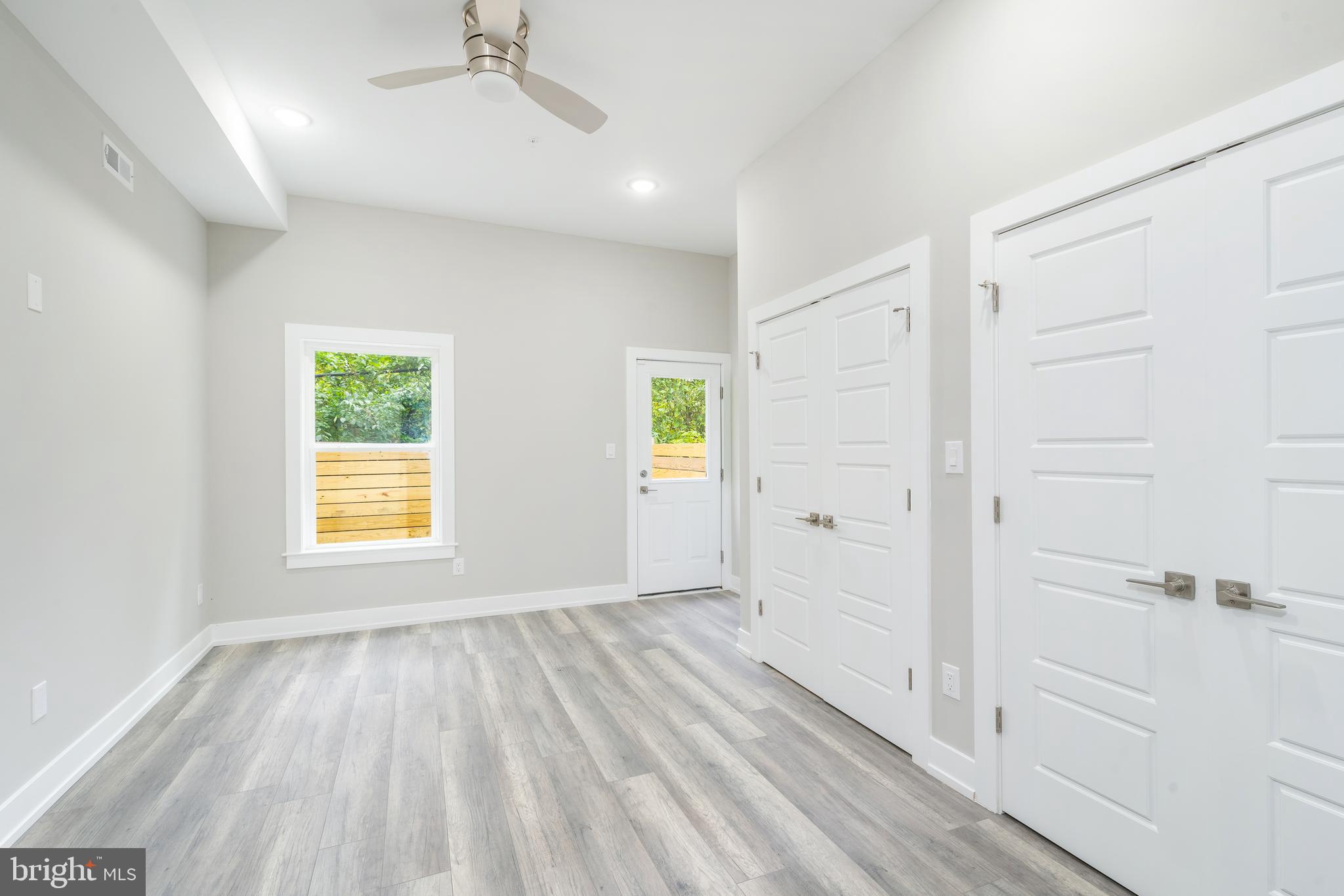 103 East Duval Street, Unit 1 Philadelphia, PA 19144 - Photo 12 of 32 a view of an empty room with wooden floor and a window