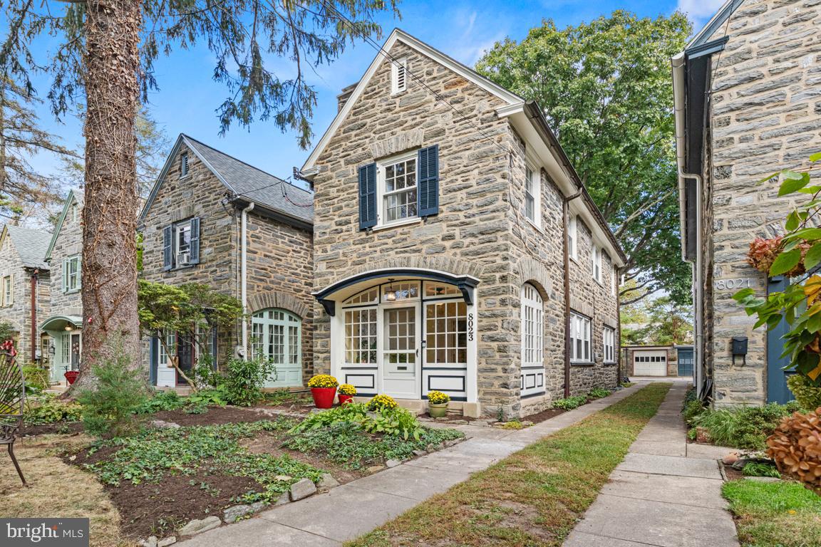 8023 Seminole Street Philadelphia, PA 19118 - Photo 1 of 42 a front view of a house with a yard