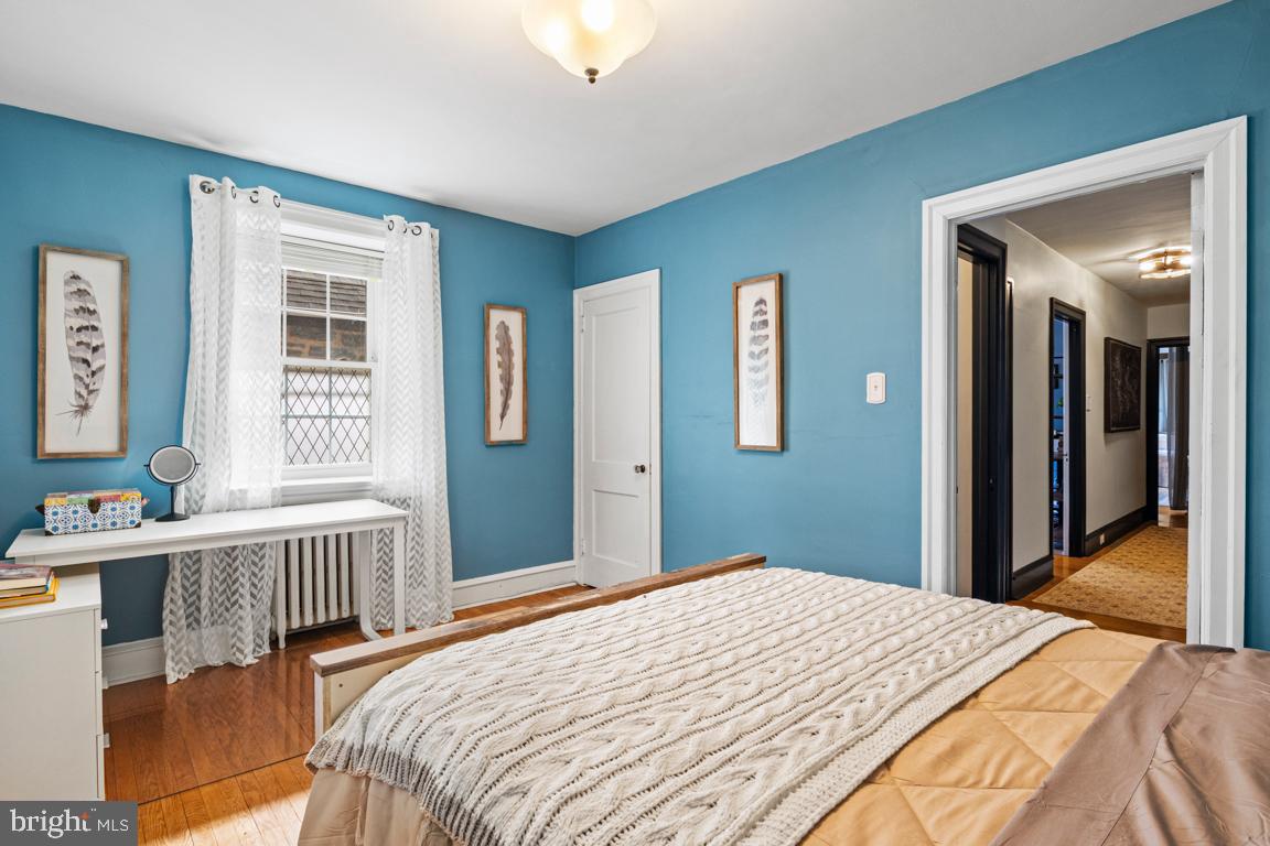 8023 Seminole Street Philadelphia, PA 19118 - Photo 26 of 42 a bedroom with a bed and a window