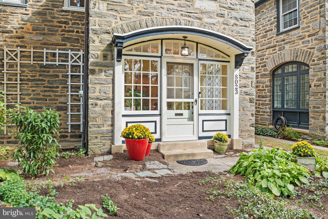 8023 Seminole Street Philadelphia, PA 19118 - Photo 4 of 42 a front view of a house with outdoor seating