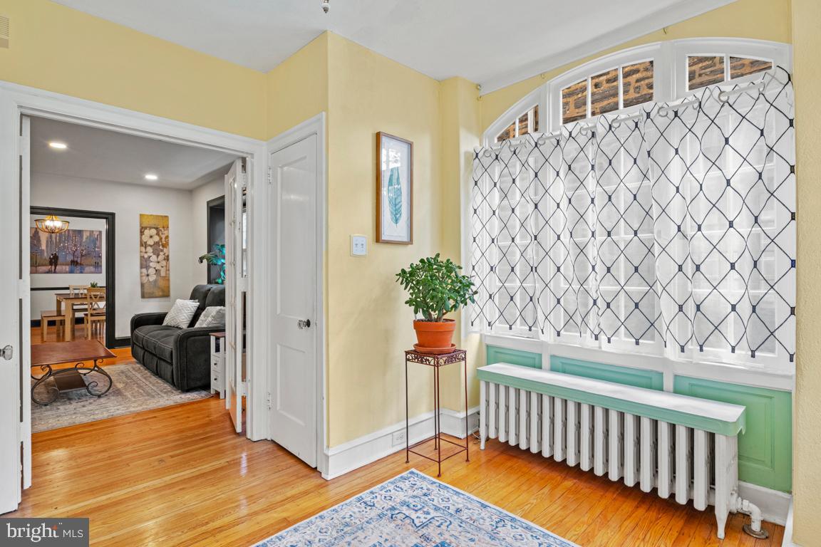 8023 Seminole Street Philadelphia, PA 19118 - Photo 6 of 42 a bedroom with furniture and wooden floor