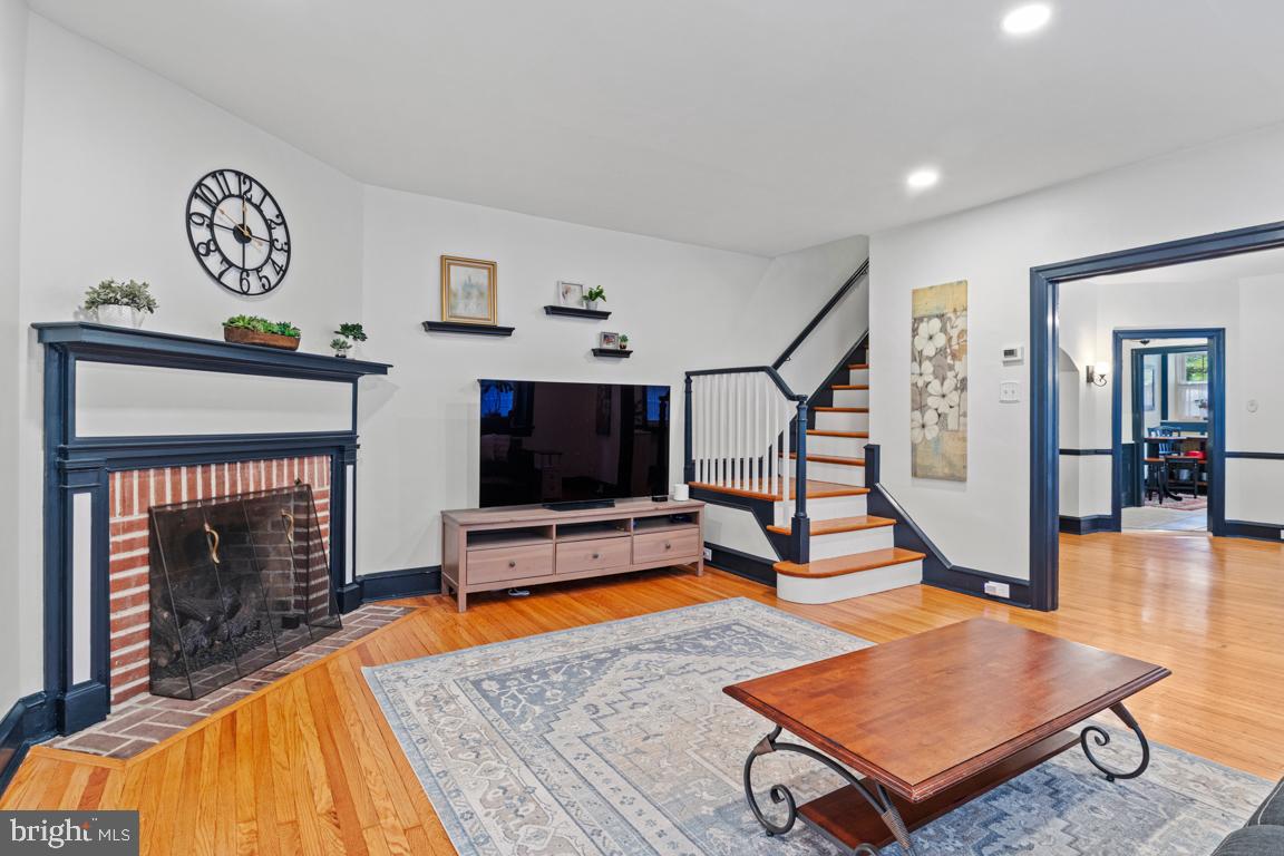 8023 Seminole Street Philadelphia, PA 19118 - Photo 7 of 42 a living room with furniture pool table and a fireplace
