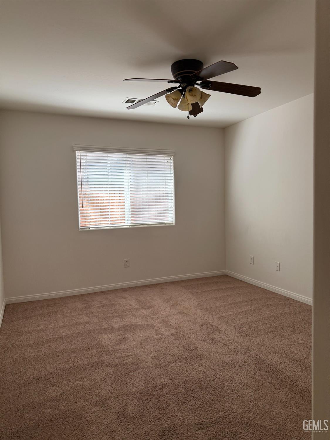 Undisclosed Address Bakersfield, CA 93311 - Photo 9 of 23 a view of an empty room with a window