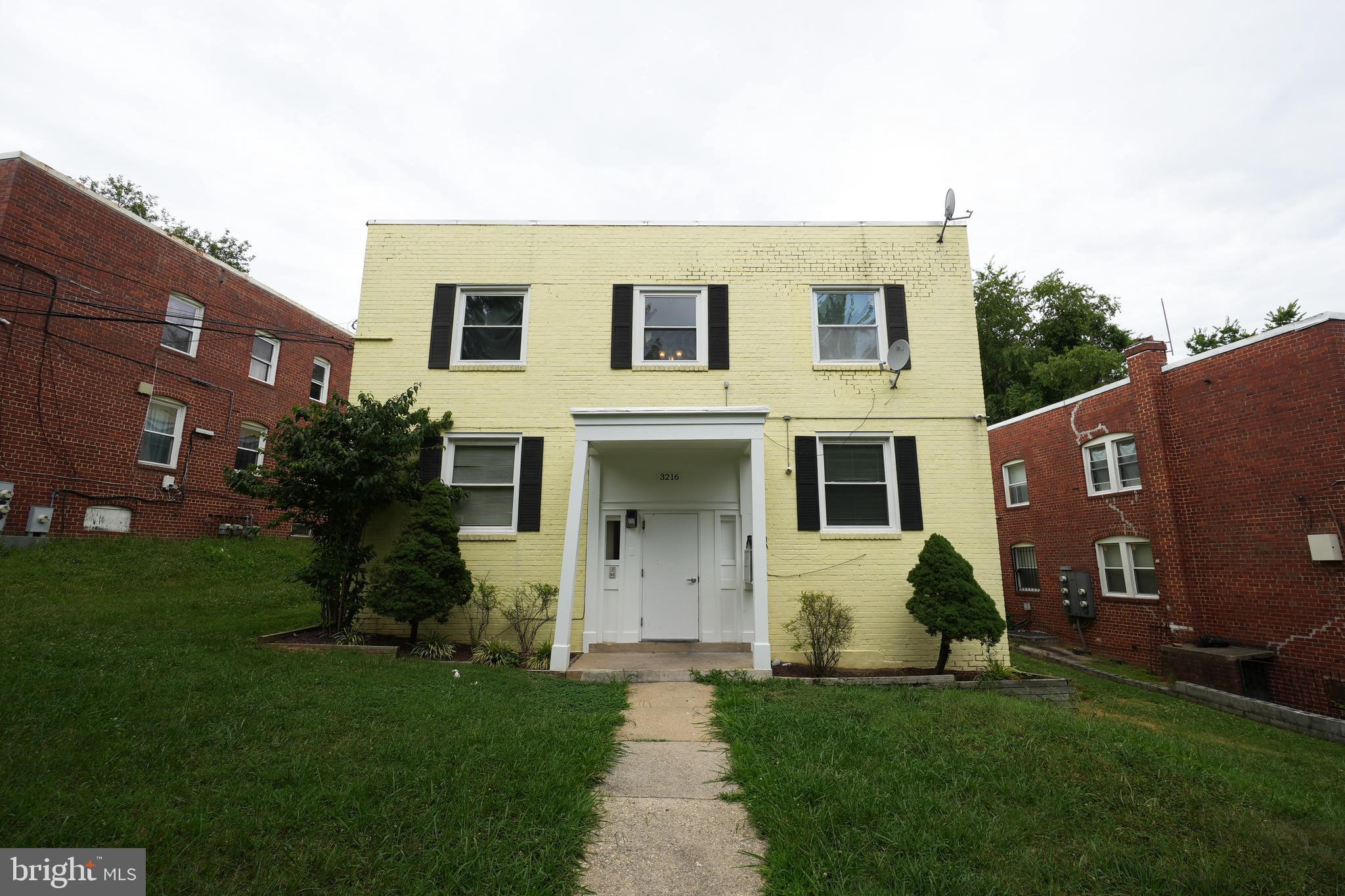 3216 28th Street Southeast, Unit 2 Washington, DC 20020 - Photo 2 of 17 a view of a yard in front of a house