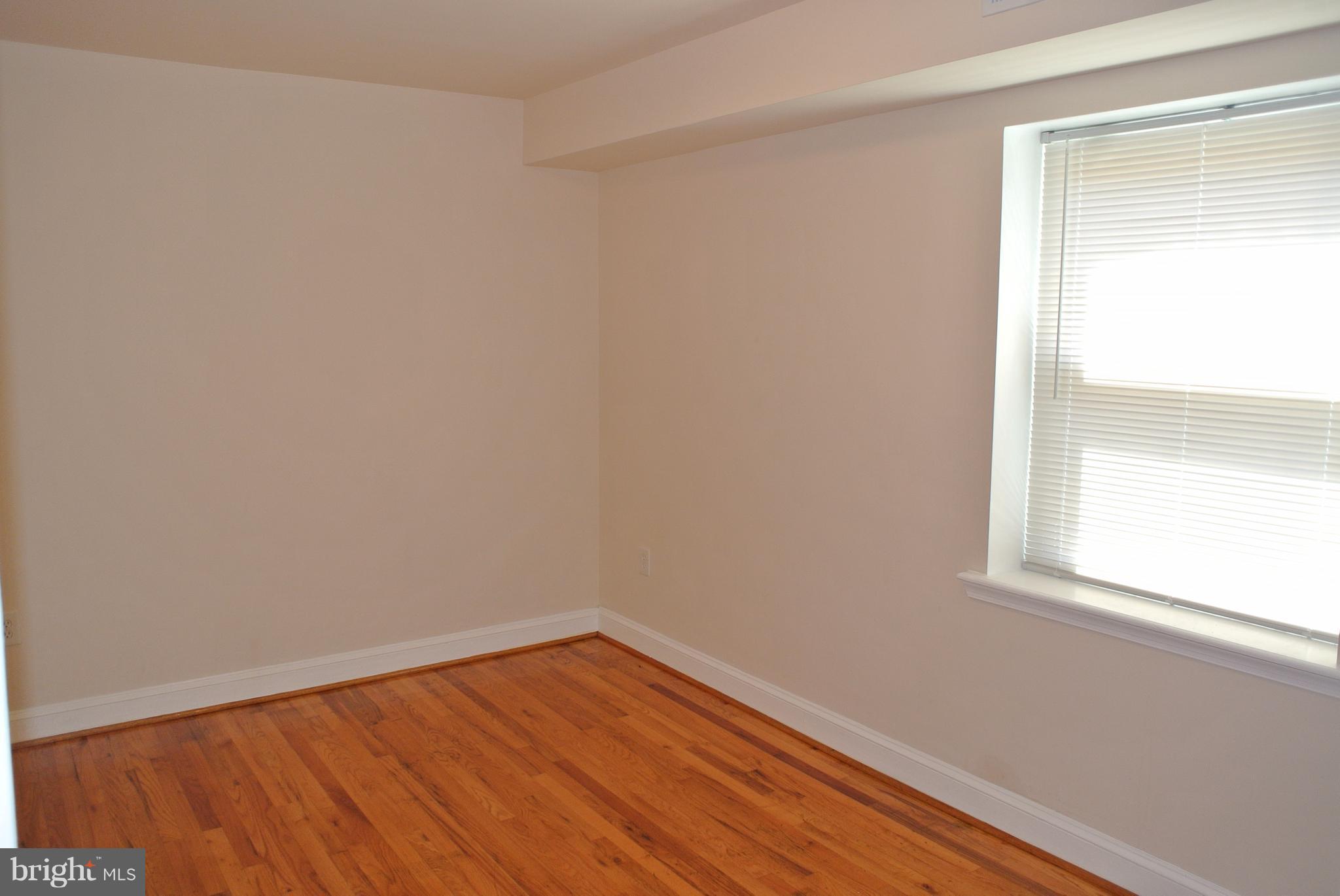 3216 28th Street Southeast, Unit 2 Washington, DC 20020 - Photo 8 of 17 an empty room with a window
