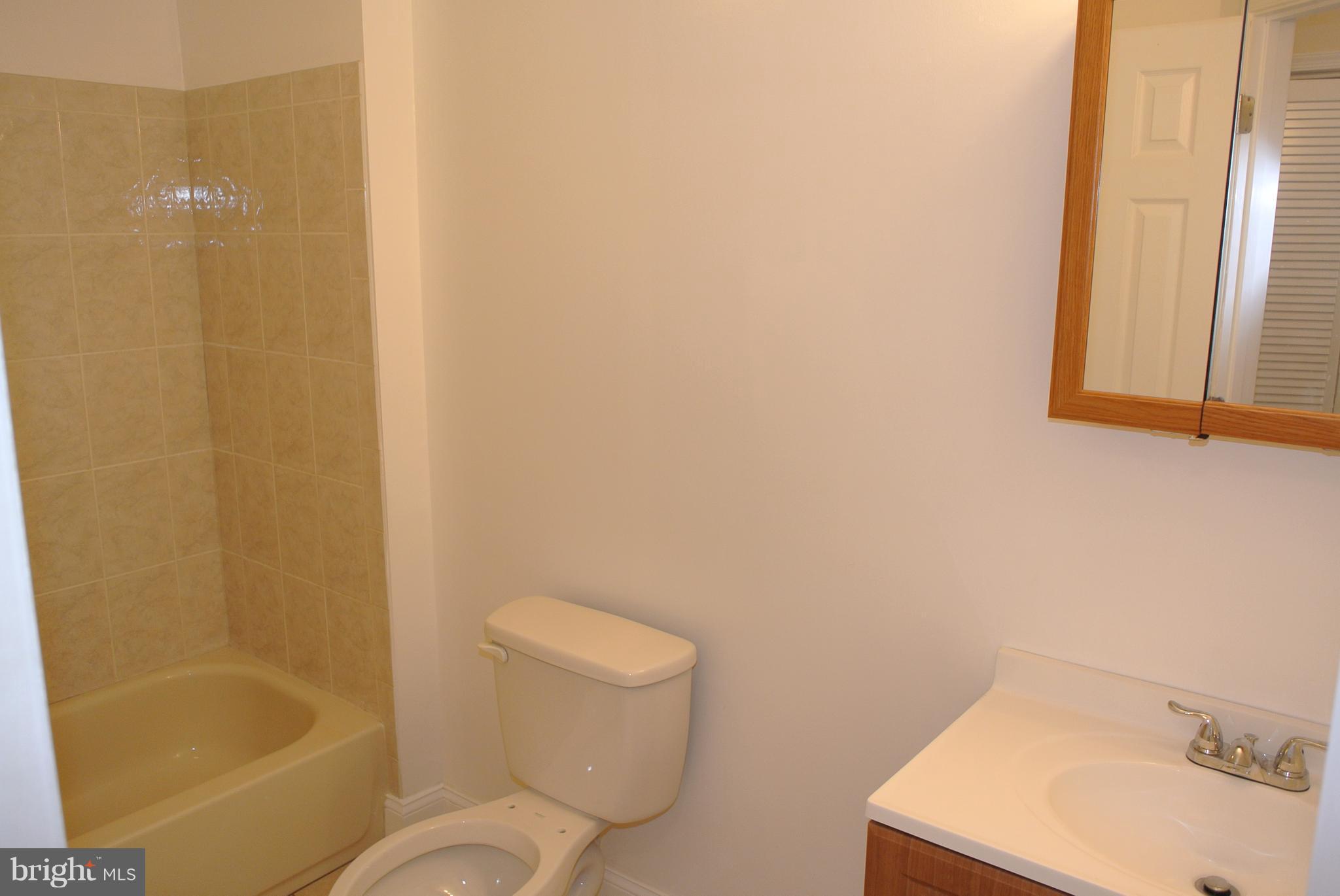 3216 28th Street Southeast, Unit 2 Washington, DC 20020 - Photo 10 of 17 a bathroom with a toilet and a sink