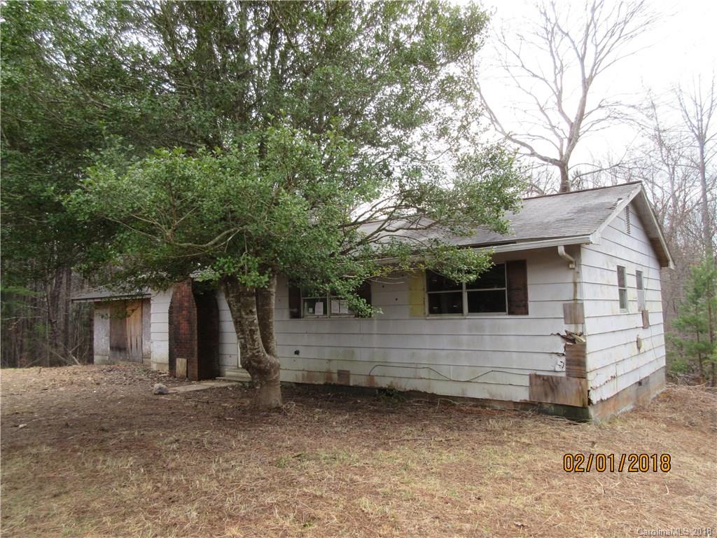 662 Mcguinn Road Mill Spring, NC 28756 - Photo 1 of 15 a view of a small white house