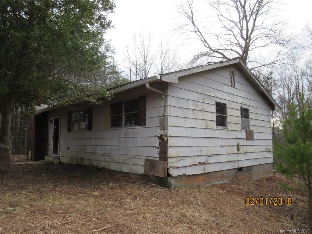 662 Mcguinn Road Mill Spring, NC 28756 - Photo 14 of 15 a view of a house with a yard