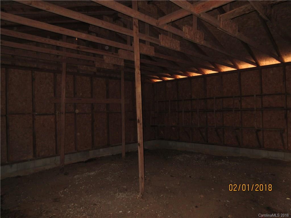 662 Mcguinn Road Mill Spring, NC 28756 - Photo 15 of 15 a view of a room with wooden walls