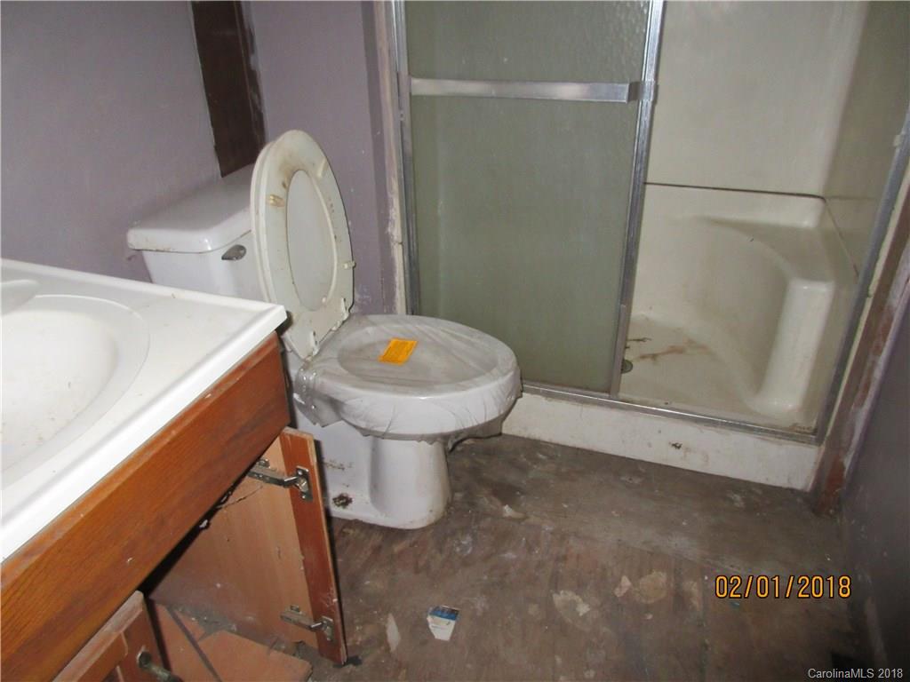 662 Mcguinn Road Mill Spring, NC 28756 - Photo 9 of 15 a bathroom with a sink toilet and shower