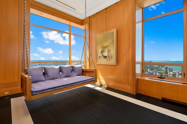 a room with gym equipment and a large mirror