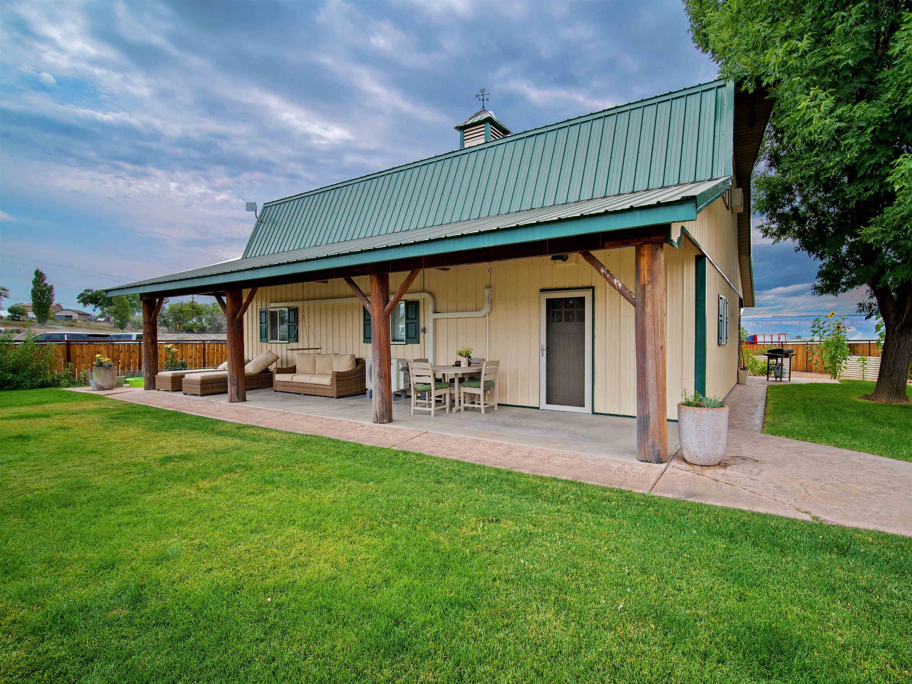 1161 23 Road Grand Junction, CO 81505 - Photo 2 of 35 a view of an house with backyard porch and sitting area