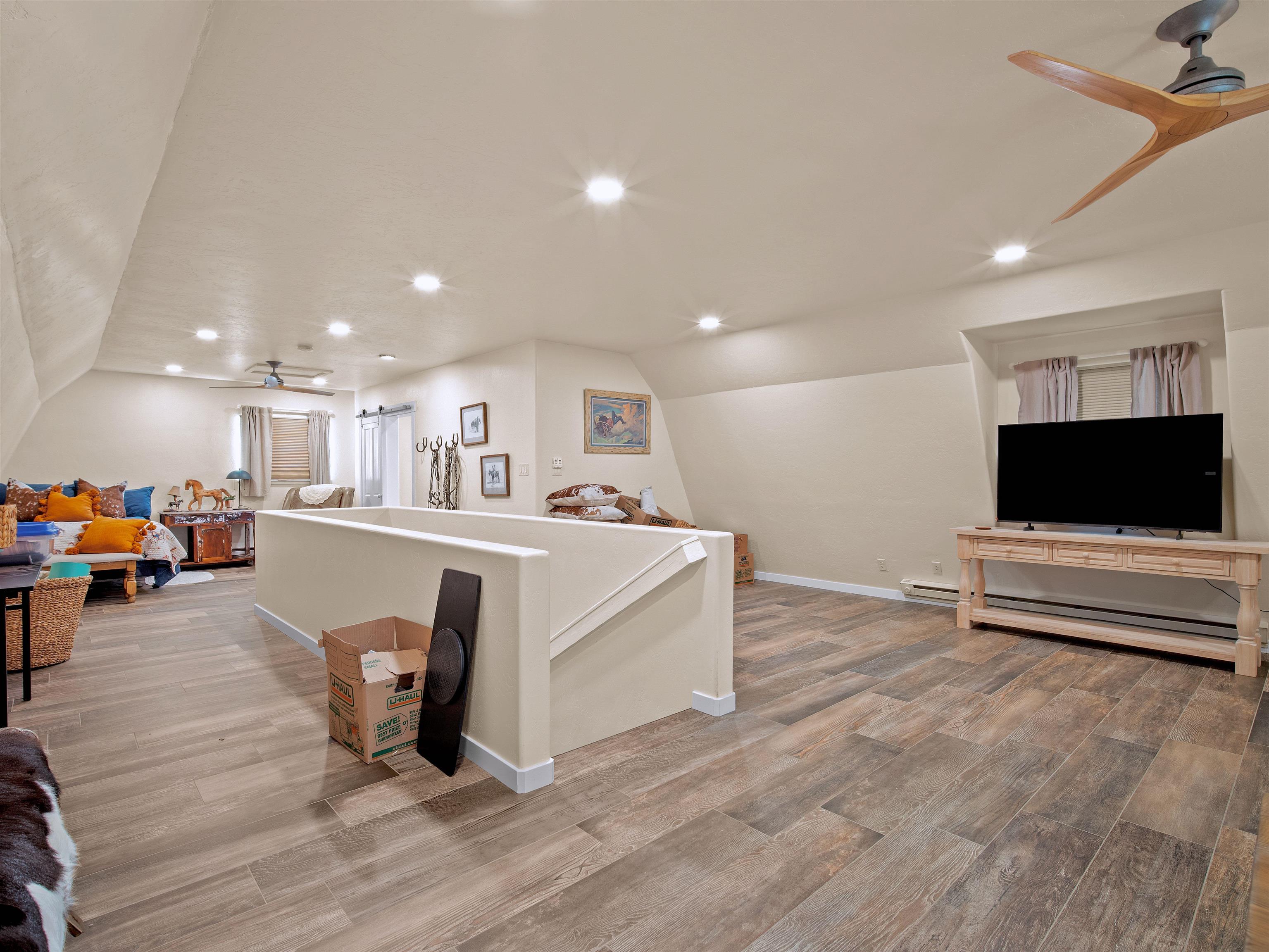 1161 23 Road Grand Junction, CO 81505 - Photo 21 of 35 a living room with furniture and a flat screen tv