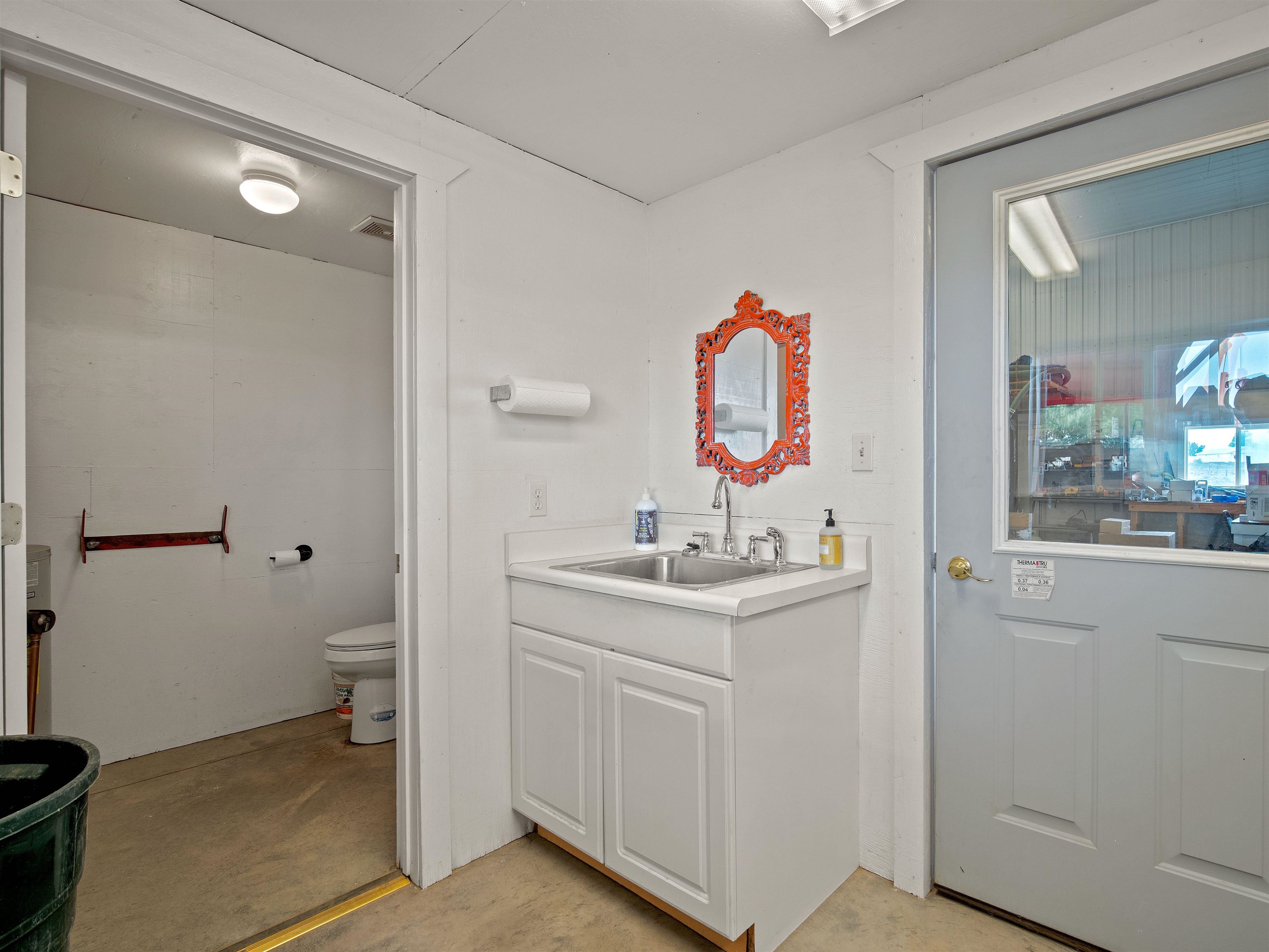 1161 23 Road Grand Junction, CO 81505 - Photo 25 of 35 a bathroom with a toilet sink and mirror