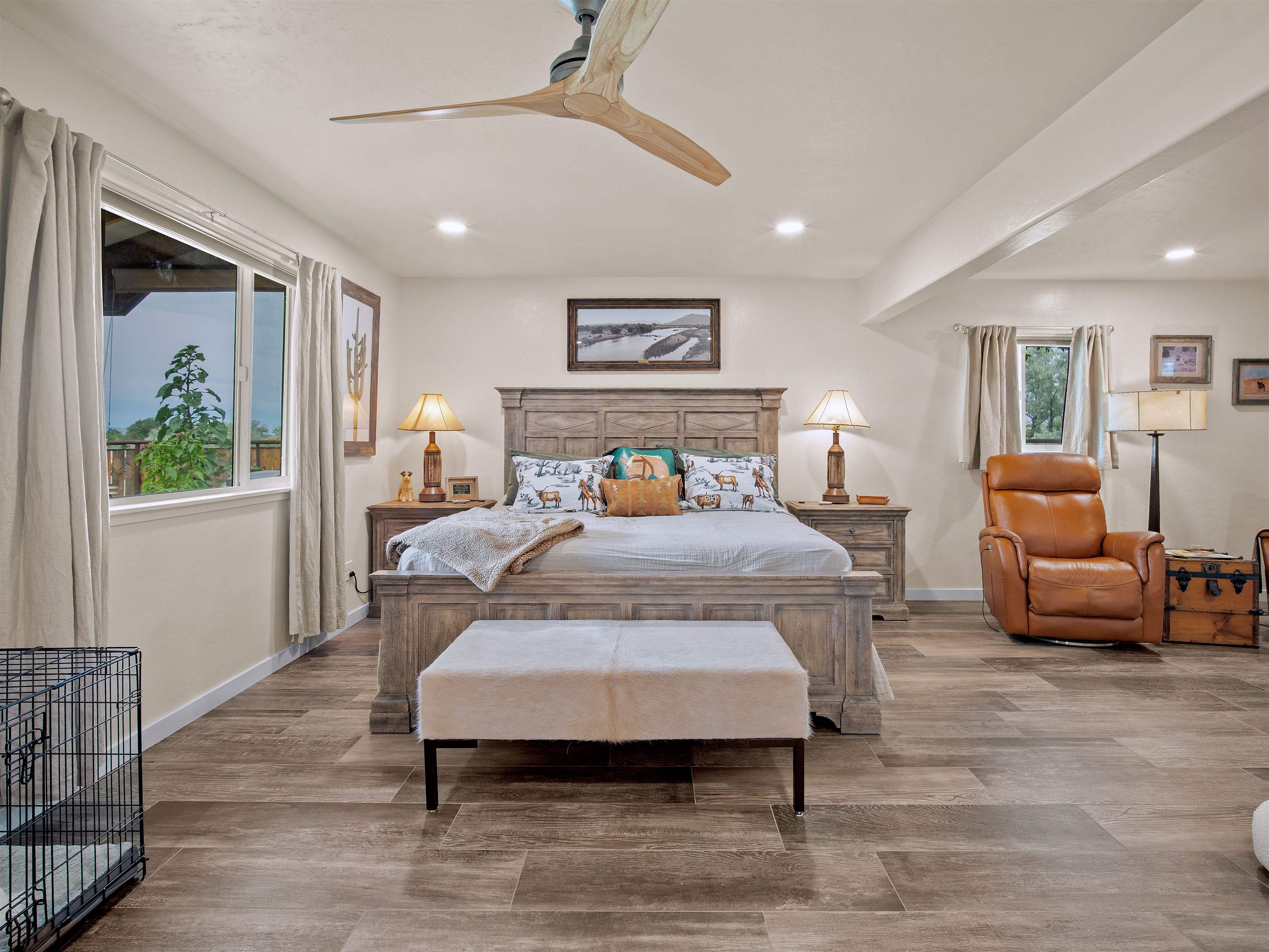 1161 23 Road Grand Junction, CO 81505 - Photo 33 of 35 a spacious bedroom with a bed a couch and a window