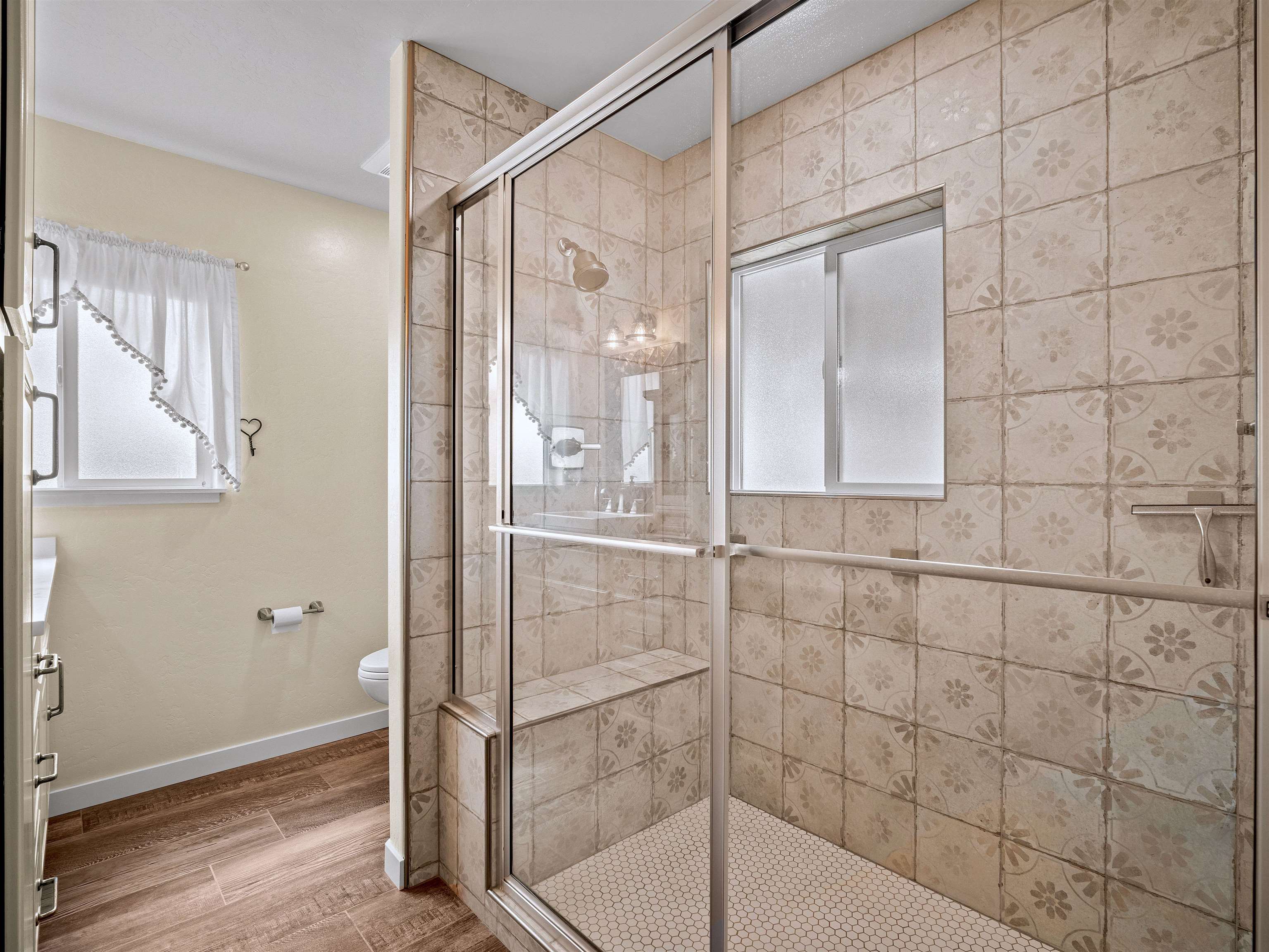 1161 23 Road Grand Junction, CO 81505 - Photo 35 of 35 a bathroom with a glass shower door and a window