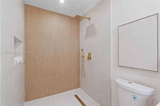 a bathroom with a shower and a toilet