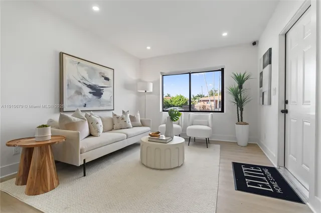 a living room with furniture and a rug