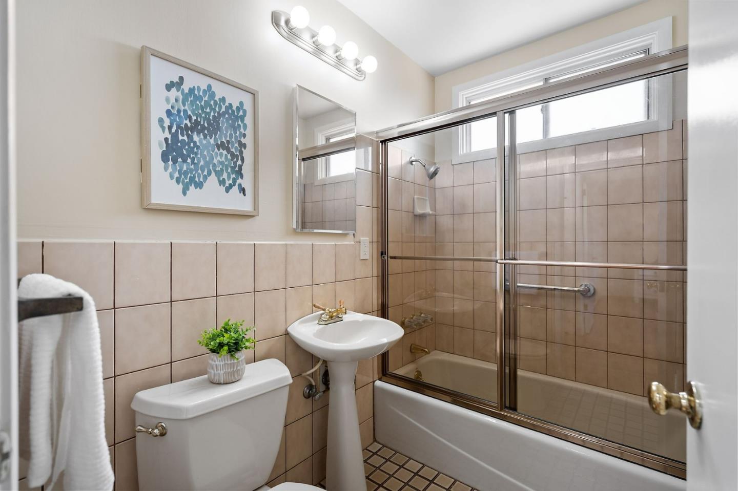 1127 Palou Drive Pacifica, CA 94044 - Photo 15 of 25 a bathroom with a sink toilet and shower