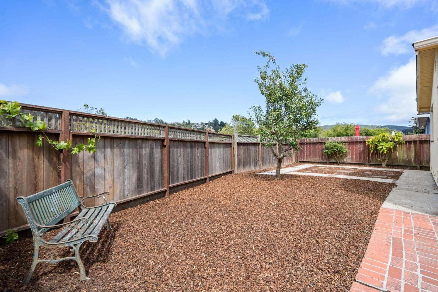 1127 Palou Drive Pacifica, CA 94044 - Photo 23 of 25 a view of a chair and table on the terrace