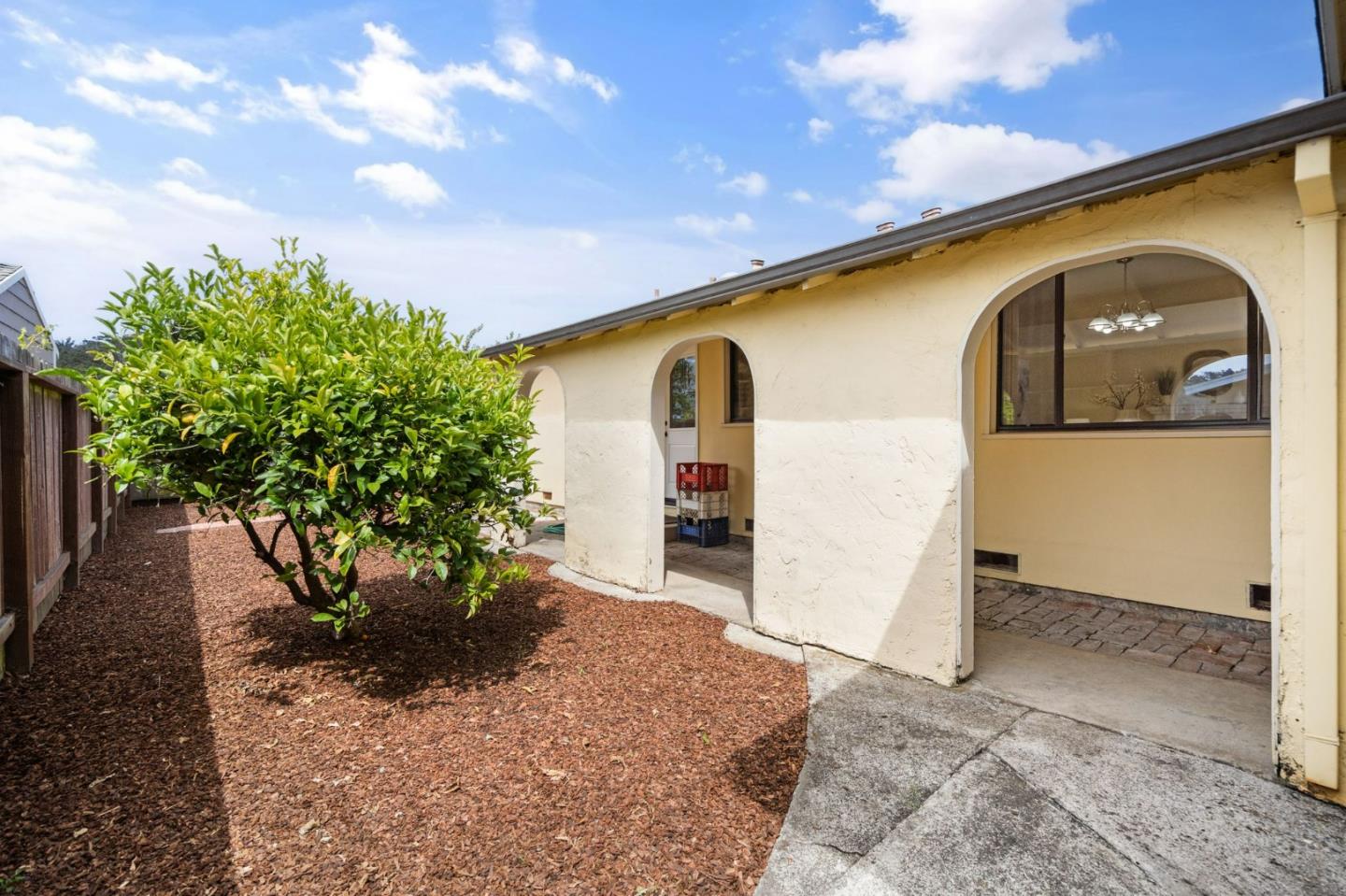 1127 Palou Drive Pacifica, CA 94044 - Photo 24 of 25 a front view of a house with a yard