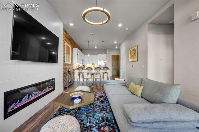 a living room with furniture and a flat screen tv