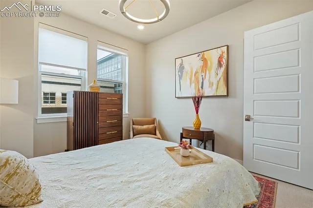 a bathroom with a toilet a sink and a mirror