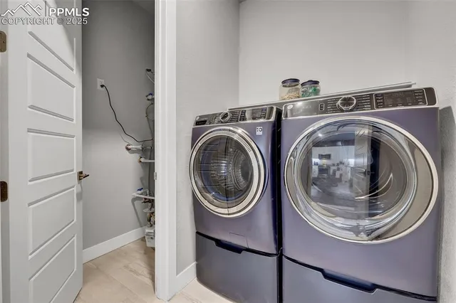a utility room with dryer and washer