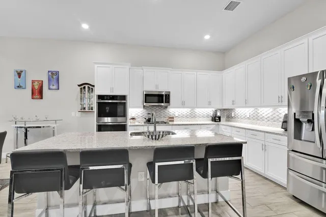 a living room with furniture and large window