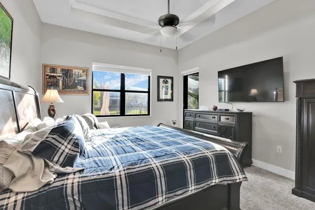 a spacious bathroom with a double vanity sink a mirror and shower