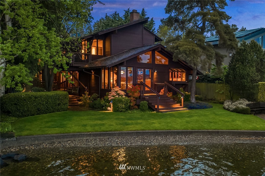 6669 Northeast Windermere Road Seattle, WA 98115 - Photo 1 of 36 a front view of a house with garden