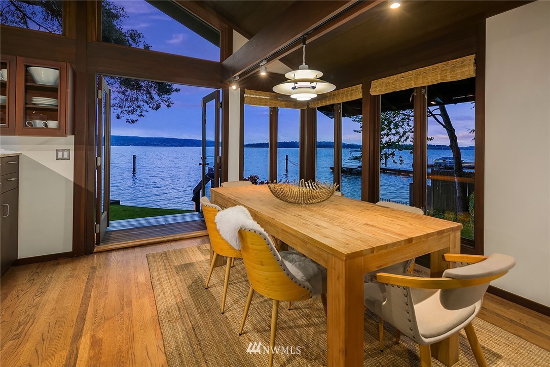6669 Northeast Windermere Road Seattle, WA 98115 - Photo 13 of 36 a view of a dining room with furniture window and wooden floor