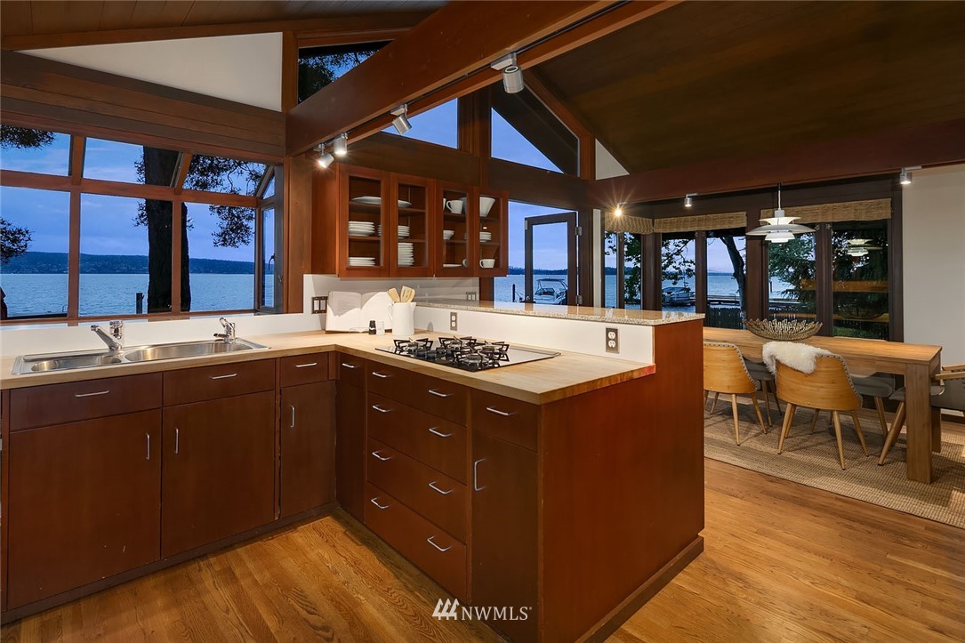 6669 Northeast Windermere Road Seattle, WA 98115 - Photo 14 of 36 a kitchen with a sink and wooden cabinets
