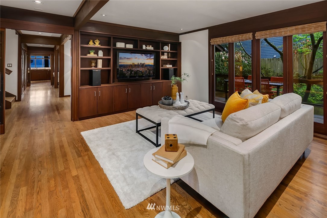 6669 Northeast Windermere Road Seattle, WA 98115 - Photo 15 of 36 a living room with furniture and large windows