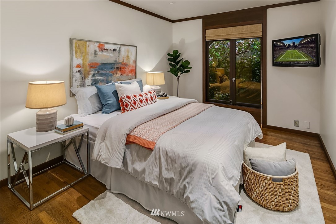 6669 Northeast Windermere Road Seattle, WA 98115 - Photo 22 of 36 a bedroom with a bed and a window