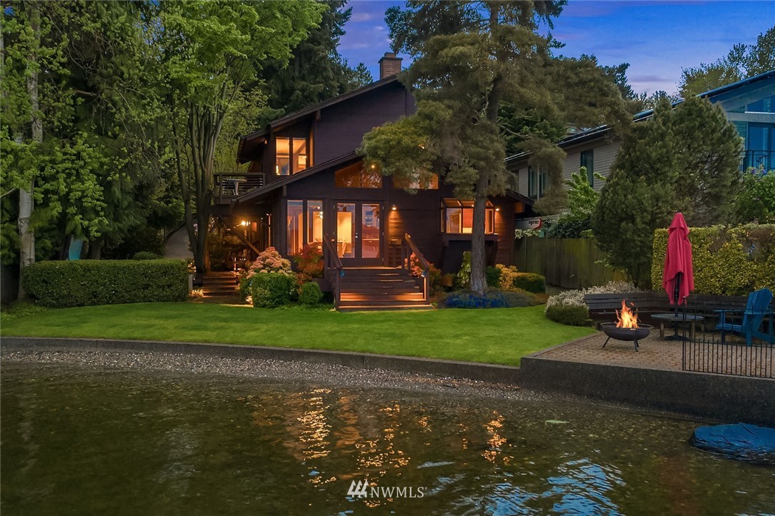 6669 Northeast Windermere Road Seattle, WA 98115 - Photo 28 of 36 a front view of a house with garden and trees