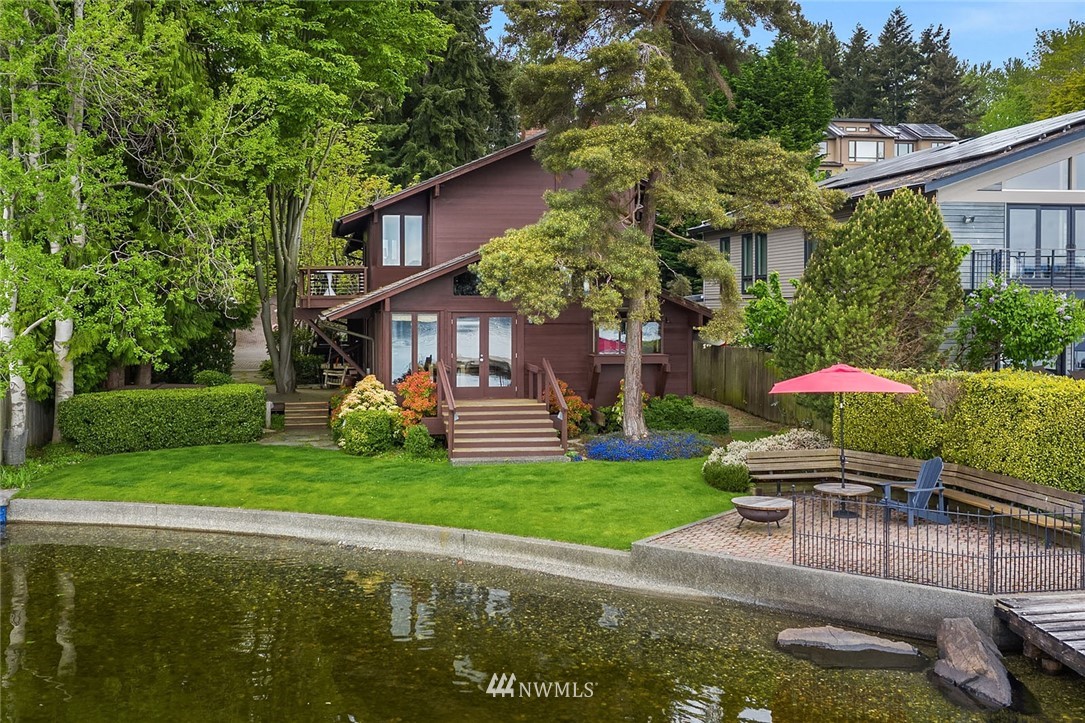 6669 Northeast Windermere Road Seattle, WA 98115 - Photo 30 of 36 a view of a house with a yard