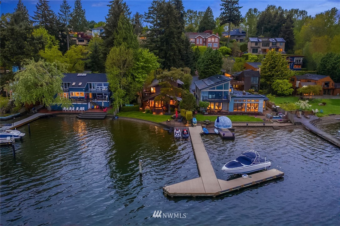6669 Northeast Windermere Road Seattle, WA 98115 - Photo 34 of 36 a view of a lake with a house swimming pool and outdoor seating