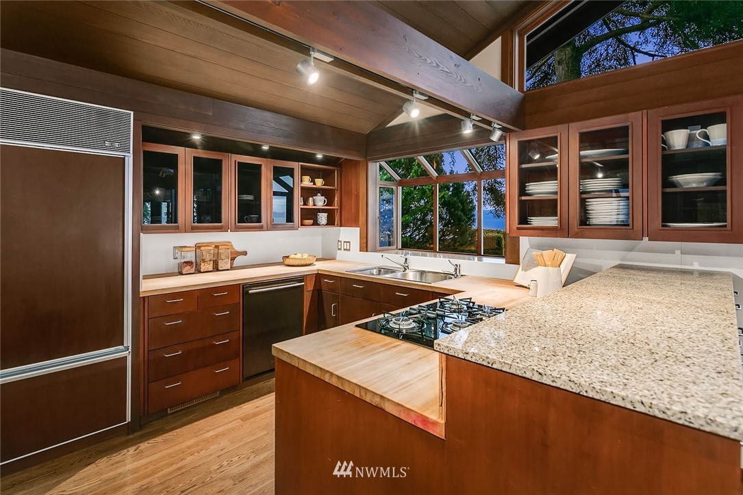 6669 Northeast Windermere Road Seattle, WA 98115 - Photo 10 of 36 a kitchen with a stove a sink and a refrigerator