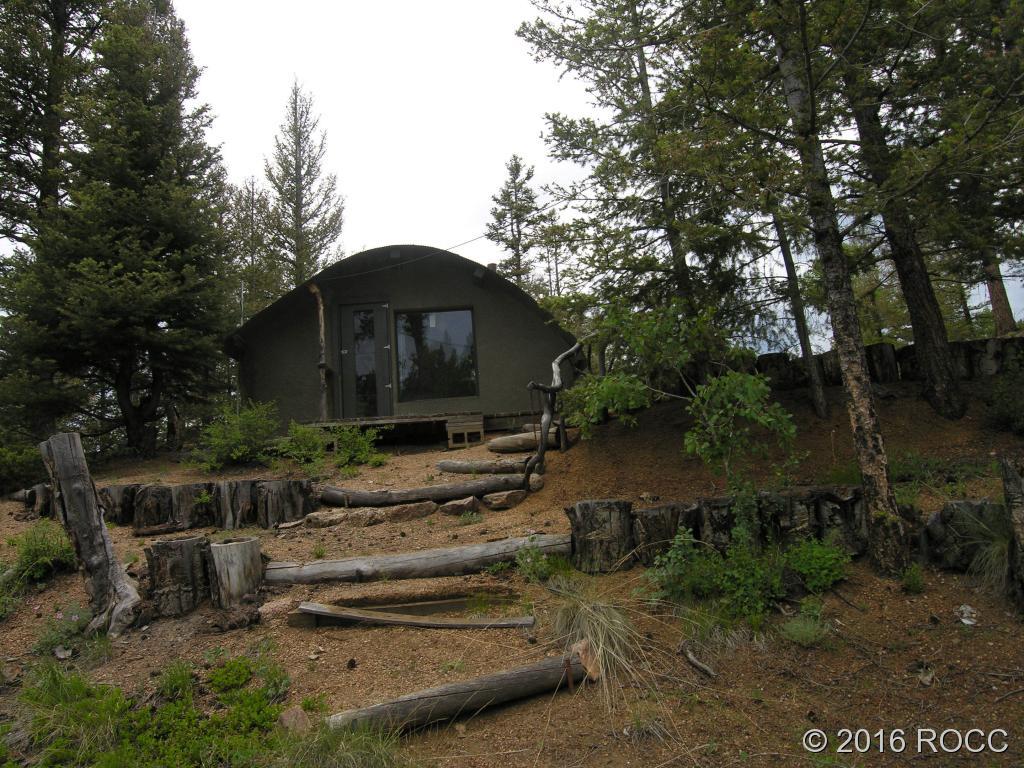 880 Burno Mountain Road Cotopaxi, CO 81223 - Photo 14 of 19 a front view of a house with a garden