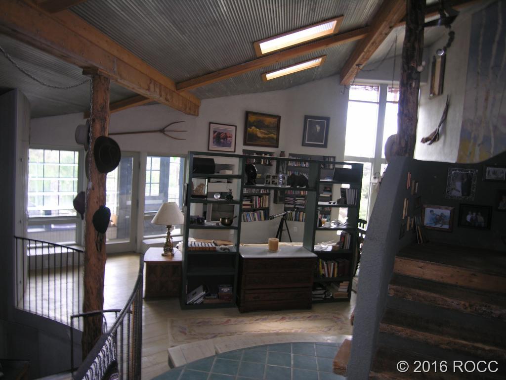 880 Burno Mountain Road Cotopaxi, CO 81223 - Photo 5 of 19 a room with lots of wooden furniture